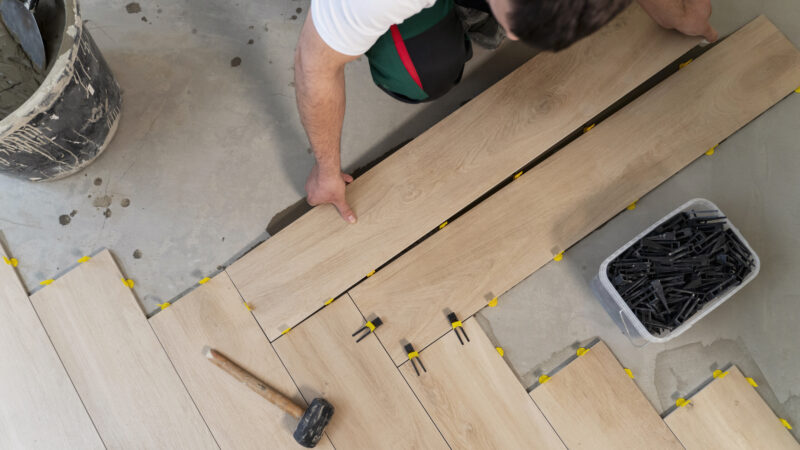 top-view-man-tiling-floor
